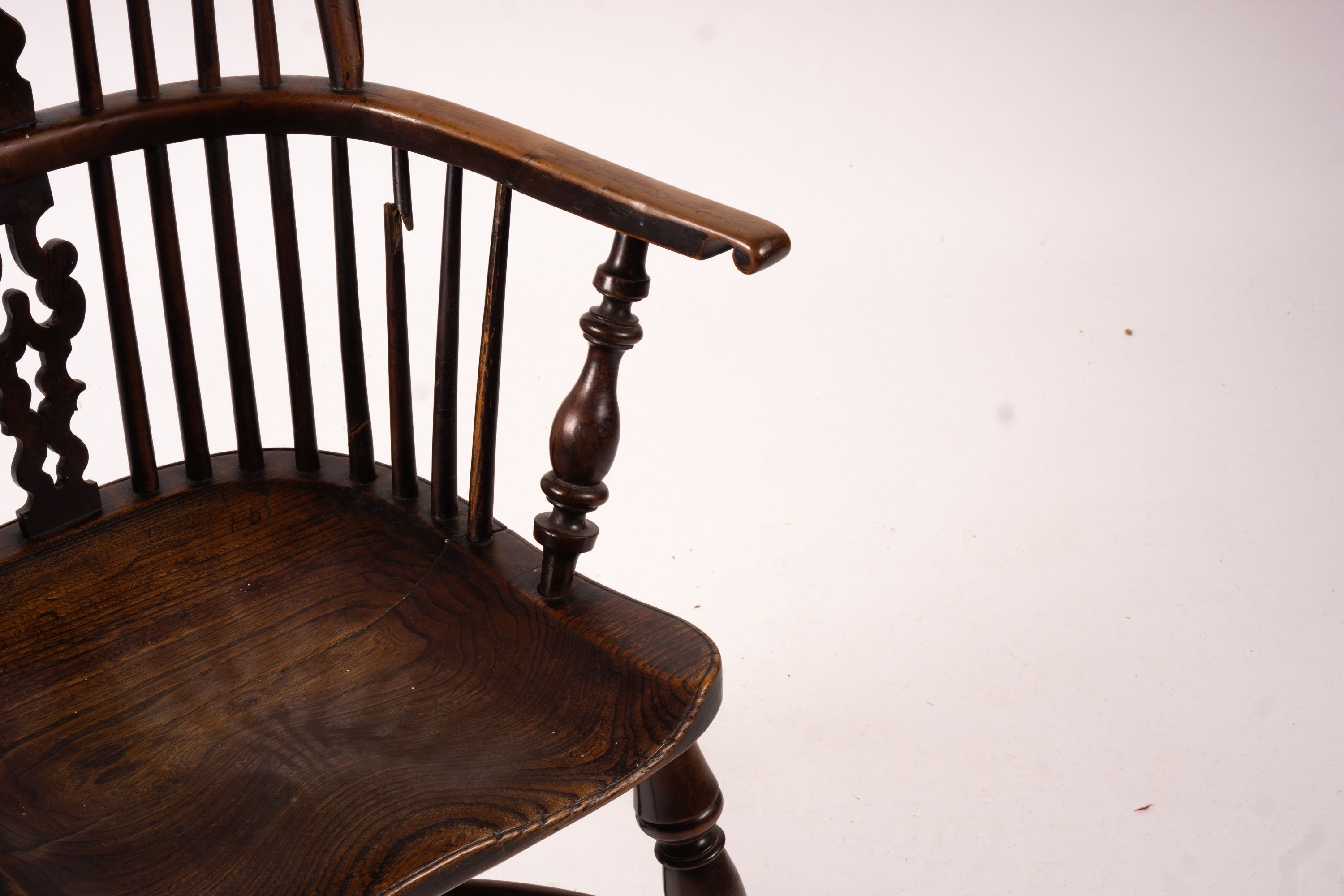 A mid 19th century yew and elm Yorkshire area Windsor armchair with saddle-seat and crinoline stretcher, width 63cm, depth 47cm, height 110cm